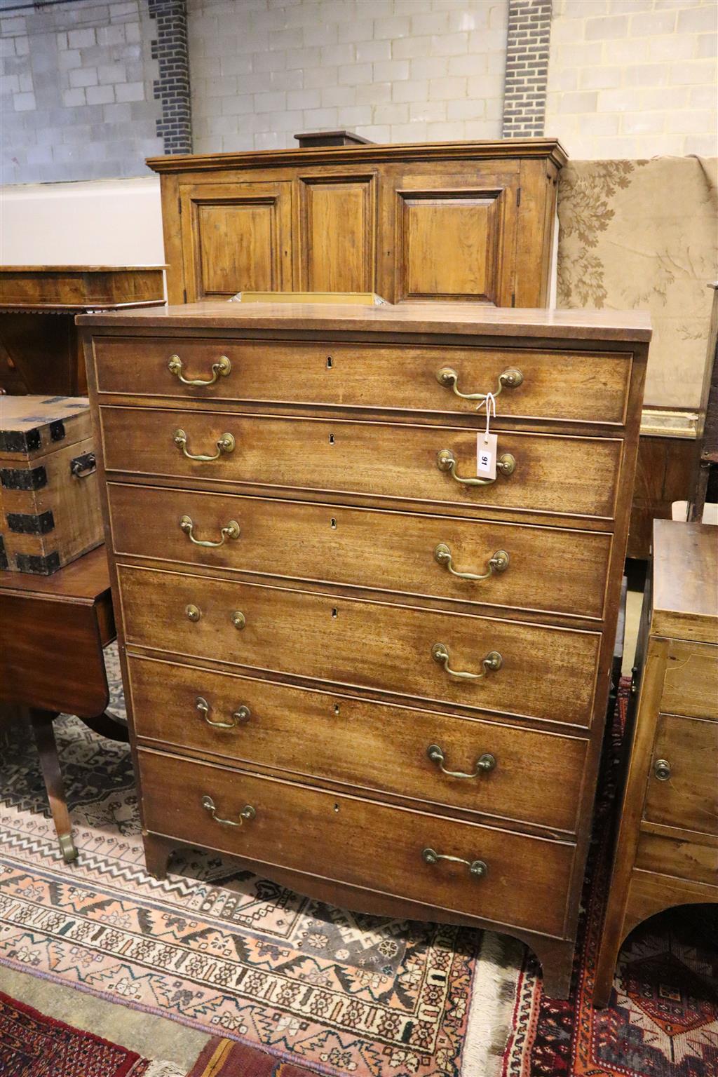 A tall George III mahogany chest, fitted six long drawers, width 99cm, depth 50cm, height 129cm